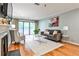 Bright living room with fireplace, balcony, hardwood floors, and comfortable seating at 214 Ridley Howard Ct, Decatur, GA 30030