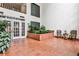 Welcoming building lobby featuring tiled flooring and a beautiful indoor garden at 214 Ridley Howard Ct, Decatur, GA 30030