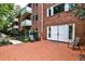 Charming exterior patio with brick flooring and access to green space at 214 Ridley Howard Ct, Decatur, GA 30030