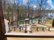 Beautiful backyard view with patio, fire pit and walkway to private covered dock on the lake at 6041 Blackberry Ln, Buford, GA 30518