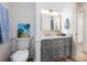 Bathroom featuring a grey vanity with granite countertops, toilet, and access to shower at 6041 Blackberry Ln, Buford, GA 30518