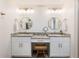 Bathroom featuring dual vanities with granite countertops, wood stool, brushed gold hardware, and custom mirrors at 6041 Blackberry Ln, Buford, GA 30518