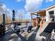 Multi-level deck with seating, a hot tub, and a lake view at 6041 Blackberry Ln, Buford, GA 30518