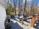 Deck with a table and chairs overlooking a wooded area at 6041 Blackberry Ln, Buford, GA 30518