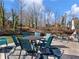 Outdoor seating area on the dock with lake view and table and chairs; great for entertaining or relaxing by the water at 6041 Blackberry Ln, Buford, GA 30518