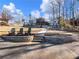 Beautiful home with landscaped terraces leading to backyard with lake view at 6041 Blackberry Ln, Buford, GA 30518