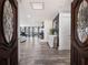 Welcoming foyer with decorative glass front doors leading into the open-concept living space at 6041 Blackberry Ln, Buford, GA 30518