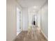 Hallway with many doors and recessed lighting leads to other areas of the basement at 6041 Blackberry Ln, Buford, GA 30518