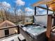 Relaxing hot tub on deck with picturesque lake views, enhancing outdoor living and leisure at 6041 Blackberry Ln, Buford, GA 30518