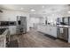 Kitchen with stainless steel appliances, granite countertops, and an island with a sink at 6041 Blackberry Ln, Buford, GA 30518