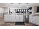 Expansive kitchen with granite island, stainless steel appliances, and access to the living area at 6041 Blackberry Ln, Buford, GA 30518