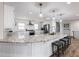 Modern kitchen features a spacious island, granite countertops and stainless steel appliances at 6041 Blackberry Ln, Buford, GA 30518