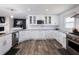 Well-equipped kitchen with granite countertops, stainless appliances, and ample storage at 6041 Blackberry Ln, Buford, GA 30518
