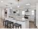Bright kitchen boasts stainless steel appliances, granite countertops, and a breakfast bar at 6041 Blackberry Ln, Buford, GA 30518