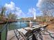 Lakeside deck offering comfortable loungers and picturesque views, perfect for relaxing and soaking up the sun at 6041 Blackberry Ln, Buford, GA 30518