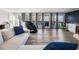 Bright living room with large windows and a view of the backyard deck at 6041 Blackberry Ln, Buford, GA 30518