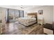 Main bedroom with hardwood floors, lots of natural light, and ensuite bathroom at 6041 Blackberry Ln, Buford, GA 30518