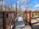 Gated pathway leading to waterfront, offering a private access to a stunning lake view at 6041 Blackberry Ln, Buford, GA 30518