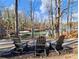 Stunning waterfront view with private docks and scenic lake vistas framed by trees at 6041 Blackberry Ln, Buford, GA 30518