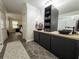 Stylish bathroom with double sink vanity and modern fixtures, adjoining doorway to main bedroom at 7445 Talbot Colony, Atlanta, GA 30328