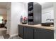 Bathroom featuring double sinks, a storage cabinet, and a granite countertop at 7445 Talbot Colony, Atlanta, GA 30328