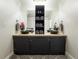 Modern bathroom with double black vessel sinks, cabinet storage, and decorative towels and flowers at 7445 Talbot Colony, Atlanta, GA 30328