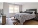 Bedroom featuring hardwood floors, a large window, and a flat-screen TV at 7445 Talbot Colony, Atlanta, GA 30328