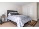 Bedroom featuring hardwood floors, a large window, and ample closet space at 7445 Talbot Colony, Atlanta, GA 30328