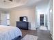 Bright bedroom featuring a vaulted ceiling, hardwood floors, and ensuite bathroom access at 7445 Talbot Colony, Atlanta, GA 30328