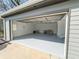 Spacious garage with epoxy floors, ample lighting, and convenient side door access at 7445 Talbot Colony, Atlanta, GA 30328