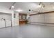 Spacious garage featuring epoxy floors, overhead lighting, and a laundry area at 7445 Talbot Colony, Atlanta, GA 30328