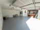 Bright and airy garage featuring epoxy flooring, ample storage, and workspace area at 7445 Talbot Colony, Atlanta, GA 30328