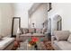 Elegant living room featuring a vaulted ceiling, comfortable gray sofas, and a large mirror at 7445 Talbot Colony, Atlanta, GA 30328