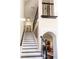 Elegant staircase with black and white accents leading to upper levels at 7445 Talbot Colony, Atlanta, GA 30328