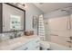 Bright bathroom featuring a vanity with marble countertop and shower-tub combination at 2015 Kilmington Sq, Alpharetta, GA 30009