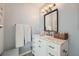 Renovated bathroom featuring a vanity with marble countertop and ample storage at 2015 Kilmington Sq, Alpharetta, GA 30009