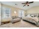 Bedroom with lots of natural light, ceiling fan and comfortable seating at 2015 Kilmington Sq, Alpharetta, GA 30009