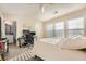 Bright bedroom with vaulted ceiling, desk space, and ensuite bathroom at 2015 Kilmington Sq, Alpharetta, GA 30009