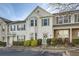 Traditional-style townhouse featuring white siding, bay window, and a charming front entrance at 2015 Kilmington Sq, Alpharetta, GA 30009