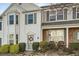 Traditional-style townhouse featuring white siding, bay window, and a charming front entrance at 2015 Kilmington Sq, Alpharetta, GA 30009