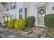 Traditional-style townhouse featuring white siding, bay window, and a charming front entrance at 2015 Kilmington Sq, Alpharetta, GA 30009