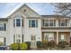Traditional-style townhouse featuring white siding, bay window, and a charming front entrance at 2015 Kilmington Sq, Alpharetta, GA 30009