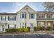Traditional-style townhouse featuring white siding, bay window, and a charming front entrance at 2015 Kilmington Sq, Alpharetta, GA 30009