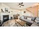 Inviting living room with hardwood floors, neutral paint, fireplace, and lots of natural light at 2015 Kilmington Sq, Alpharetta, GA 30009