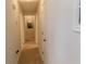 Hallway leading to bedrooms, featuring neutral paint and carpet at 230 Laurel Way, Covington, GA 30016