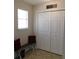 Functional laundry room with a folding area and ample closet space for storage solutions at 230 Laurel Way, Covington, GA 30016