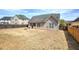 Large, fenced backyard with a fire pit, providing ample space for outdoor activities at 27 Spring Folly Nw, Cartersville, GA 30121