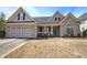 Charming single-Gathering home with a well-manicured lawn and an attached two-car garage at 27 Spring Folly Nw, Cartersville, GA 30121