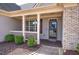Inviting front porch with classic design elements, perfect for relaxing outdoors at 27 Spring Folly Nw, Cartersville, GA 30121