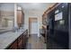 Kitchen features stainless steel appliances and dark wood cabinets, and is freshly painted at 27 Spring Folly Nw, Cartersville, GA 30121